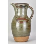 MICHAEL CASSON (1925-2003); a very large jug covered in grey glaze with iron decoration, impressed