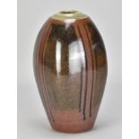 JOHN JELFS (born 1946); a stoneware bottle covered in tenmoku and kaki glaze with green ash rim