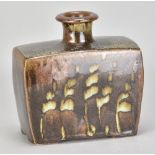 PHIL ROGERS (1951-2020); a rectangular salt glazed slab bottle covered in tenmoku breaking to kaki