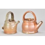 MICKI SCHLOESSINGK (born 1949); a salt glazed teapot with loop handle covered in shino glaze,