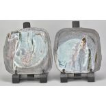 MARGARET CURTIS (born 1955); a pair of square plates partially covered in blue celadon glaze with