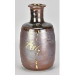 PHIL ROGERS (1951-2020); a stoneware bottle covered in iron rich glaze with wax resist decoration,
