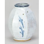 PETER SWANSON (born 1950); a cut sided stoneware vase covered in white glaze with cobalt