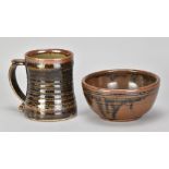 NIC HARRISON (born 1949) for Leach Pottery; a stoneware bowl covered in kaki glaze, impressed N