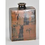 JIM MALONE (born 1946); a stoneware slab bottle covered in tenmoku and kaki glaze with wax resist