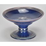 JONATHAN CHISWELL JONES (born 1944); a porcelain lustre ware tazza covered in copper/cobalt