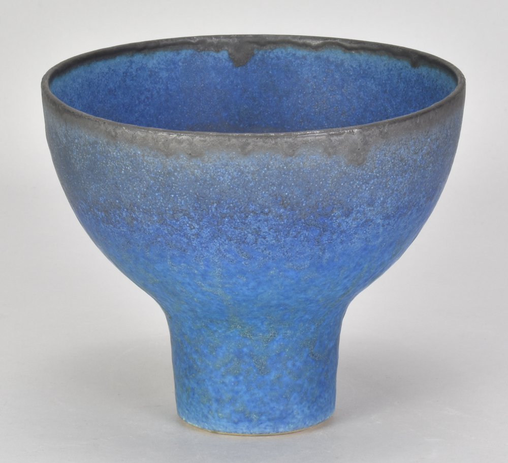 ABDO NAGI (1941-2001); a stoneware pedestal bowl covered in mottled blue/turquoise glaze with bronze