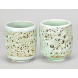 JOHN SCOTT; a pair of porcelain yunomi covered in lime green volcanic glaze, incised signature to