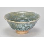 KATHARINE PLEYDELL-BOUVERIE (1895-1985); a small stoneware bowl partially covered in green and