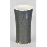 JULIAN STAIR (born 1955); an early cylindrical porcelain vessel covered in mottkled bronze glaze