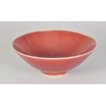 RUPERT SPIRA (born 1960); a stoneware bowl covered in red glaze, impressed RS mark, diameter 16.5cm.