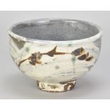 JIM MALONE (born 1946); a stoneware bowl partially covered in brushed slip with iron and copper