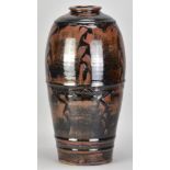 JIM MALONE (born 1946); a large stoneware bottle covered tenmoku glaze over red slip with incised