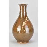 JIM MALONE (born 1946); a stoneware Korean bottle covered in kaki glaze with wax resist decoration