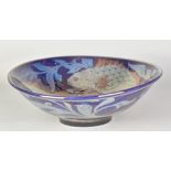 JONATHAN CHISWELL JONES (born 1944); a large porcelain lustre ware bowl covered in copper/cobalt