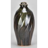 NICK REES (born 1949) for Muchelney Pottery; a faceted stoneware bottle covered in tenmoku and