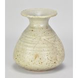 ADRIAN LEWIS-EVANS (1927-2021); a stoneware bottle covered in green ash glaze with incised