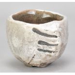 JEAN-PIERRE VIOT (born 1936); a raku chawan covered in pale grey crackle glaze with wax resist