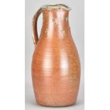 JOHN JELFS (born 1946); a tall salt glazed pitcher with grey ash top and impressed decoration to the