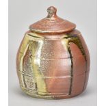 JOHN JELFS (born 1946); a wood fired stoneware jar and cover with green ash pours, impressed JJ