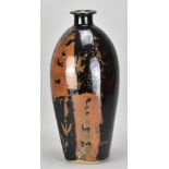 JIM MALONE (born 1946); a large stoneware bottle covered in tenmoku and kaki glaze with wax resist