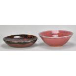 MARGARET CURTIS (born 1955); a stoneware bowl covered in copper red glaze with celadon rim and