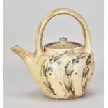 JIM MALONE (born 1946); a stoneware teapot with loop handle covered in brushed slip with iron,