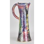 MICHAEL KENNEDY; a tall stoneware jug covered in polychrome glaze with impressed and incised