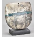 PETER HAYES (born 1946); a raku bow with fractured smoky surface and jade green wave mounted on