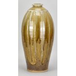 JIM MALONE (born 1946); a large fluted stoneware bottle partially covered in green ash and granite