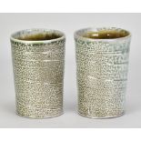 ANTHONY DIX; a pair of stoneware beakers covered in soda vapour glaze, impressed AD marks, height