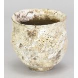 AKI MORIUCHI (born 1947); a stoneware cup form with heavily textured surface, impressed mark, height