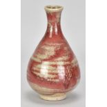 ADRIAN LEWIS-EVANS (1927-2021); a stoneware bottle partially covered in copper red glaze,