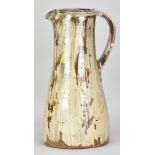 JIM MALONE (born 1946); a large stoneware pitcher covered in brushed slip with iron decoration,