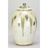 JIM MALONE (born 1946); a tall stoneware jar and cover covered in nuka glaze with copper green and