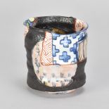 AARON SCYTHE (born 1971); a Yobitsugi style stoneware yunomi decorated with panels of brightly