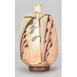 MARK GRIFFITHS (born 1956); a square stoneware bottle covered in shino glaze over iron slip with wax