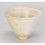 KATHARINE PLEYDELL-BOUVERIE (1895-1985); a fluted stoneware bowl covered in white ash glaze,