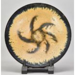 ABDO NAGI (1941-2001); a stoneware charger/wall hanging covered in mottled yellow and blue glaze