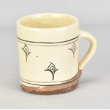 MICHAEL CARDEW (1901-1983) for Leach Pottery; a slipware mug, impressed MC and pottery marks, made