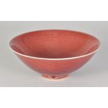 RUPERT SPIRA (born 1960); a stoneware bowl covered in red glaze, impressed RS mark, diameter 16.5cm.