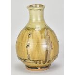 PHIL ROGERS (1951-2020); a stoneware bottle covered in green ash glaze with combed decoration,