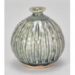 KATHARINE PLEYDELL-BOUVERIE (1895-1985); a fluted stoneware bud vase covered in blue/grey ash glaze,