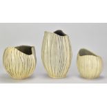 ANN WHIPP; a group of stoneware vessels of ribbed form with wavy rims, impressed and incised AW
