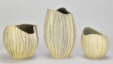 ANN WHIPP; a group of stoneware vessels of ribbed form with wavy rims, impressed and incised AW