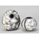 NICHOLA HANMAN; a naked raku pebble form, impressed NJH mark, height 13cm, and a matching round