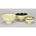 PETER WILLS (born 1955); a near pair of grogged porcelain bowls partially covered in pale yellow