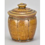 MIKE DODD (born 1943); a stoneware jar and cover covered in granite and iron glaze with incised