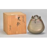 KAMOYAMA KOUICHI; a lugged stoneware bottle covered in metallic bronze glaze with running hares