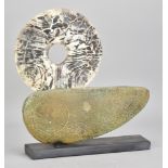 PETER HAYES (born 1946); a stoneware boat form with fractured smoky white disc mounted on slate